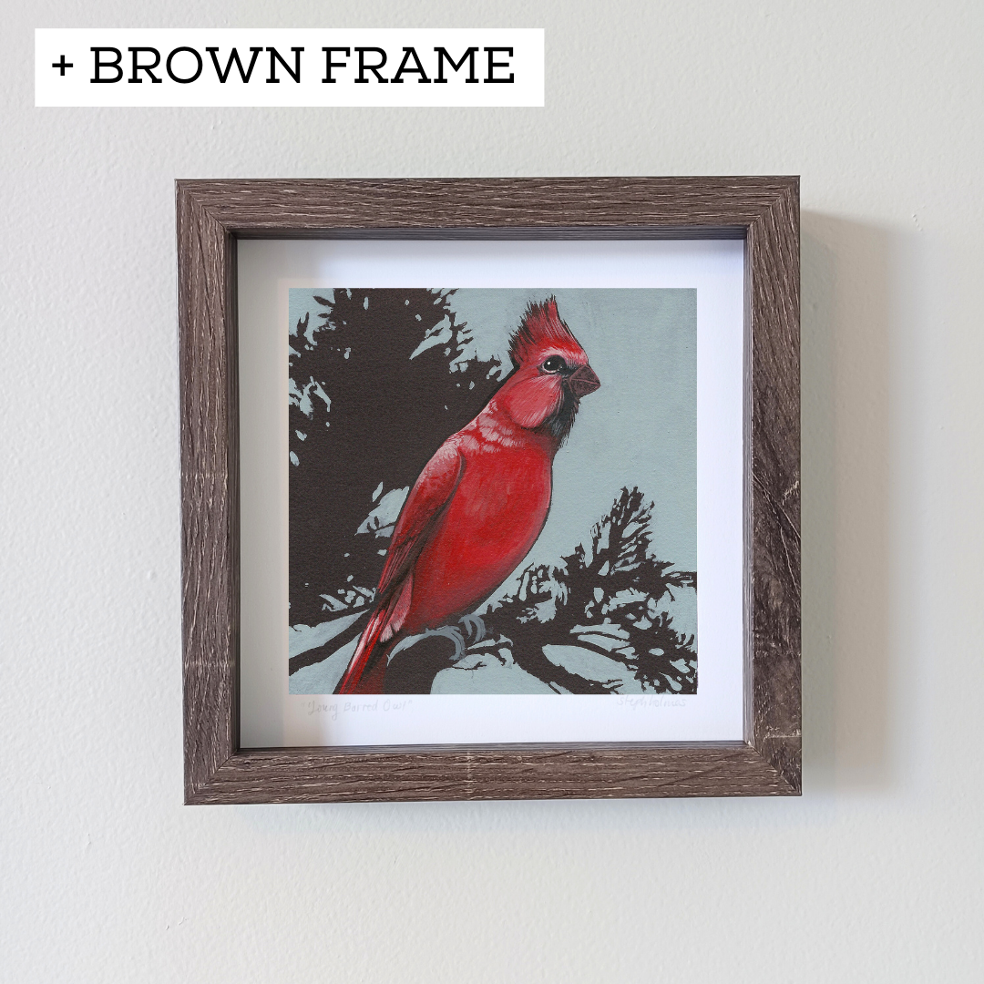 An art print of a red northern cardinal sitting on a branch.